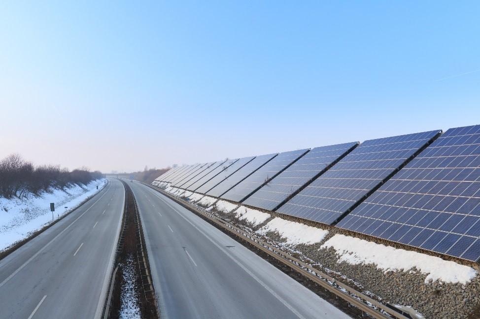 PV panels line the Autobahn in Germany.